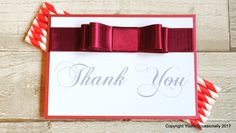 a thank you card with red and white striped straws on it, next to candy canes