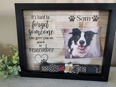 a frame with a dog's photo and keychain attached to it