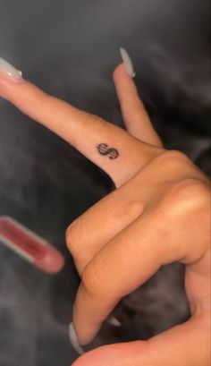 Dollar tattoo,tattoo,finger tattoo Money Sight Tattoo, Coin Size Tattoo, Money Sign Tattoo On Finger, Tattoes Idea For Women Aesthetic, Red Dollar Sign Tattoo, Small Hand Tats For Women, Dollar Sign Finger Tattoo, Tattoos To Hide From Parents, Hot Small Tattoos