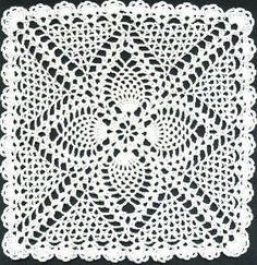 a white doily on a black background