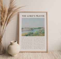 the lord's prayer is displayed in front of a vase and some dried grass