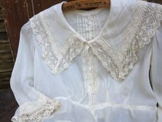 Wedding Blouse With Lace Trim And Collar, White Lace Blouse For Daywear, Feminine Lace Work Blouse For Daywear, Summer Wedding Blouse With Buttons, White Lace Work Tops For Daywear, Collared Lace Trim Top For Wedding, Cream Blouse With Lace Collar For Daywear, Off White Lace Trim Top For Daywear, Wedding Top With Lace Trim And Collar