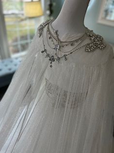 a white dress on display in a room