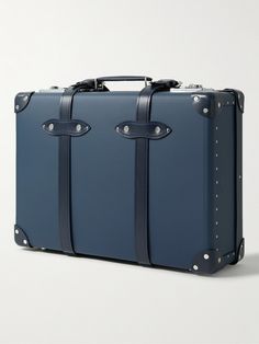 Globe-Trotter's 'Centenary' carry-on suitcase is part of the label's limited-edition capsule for its 125th anniversary, which is the number of pieces created for it. Punctuated with polished gold-tone hardware, it's been crafted in the UK from vulcanised fibreboard and has tonal leather straps and a telescopic handle for easy maneuvering. The 'Heritage Blue' colourway dates back to 1897. Luxury Briefcase With Luggage Sleeve For Trip, Luxury Travel Cases, Luxury Cases With Luggage Sleeve For Trips, Luxury Travel Cases With Luggage Sleeve, Luxury Rectangular Cases For Trip, Luxury Rectangular Travel Cases, Luxury Luggage With Rectangular Case And Sleeve, Luxury Rectangular Luggage With Sleeve, Luxury Travel Luggage With Rectangular Case