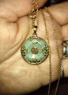 Green Medallion Jewelry For Anniversary, Green Engraved Necklace For Collectors, Antique Jade Jewelry As A Gift, Antique Jade Jewelry For Anniversary, Antique Green Round Pendant Jewelry, Antique Jade Jewelry For Gift, Gold Jade Round Pendant Jewelry, Vintage Jade Pendant Jewelry, Antique Green Jade Necklace