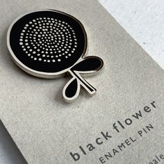 A Single Enamel pin brooch featuring a design from my Single Flower Head Print which is from one of my original Pen and Ink drawings. High quality hard black enamel with nickel  plating and detailing with 2 metal clutch fastening on reverse. Your Enamel Pin will arrive with a backing card wrapped in 100% recycled tissue paper  in a padded envelope for protection - Nickle (Silver) plating and detailing - Custom made from high quality hard enamel. - 2 metal clutch fastenings on reverse - Size 30mm Black Brooch Lapel Pin As Gift, Black Lapel Pin Brooch As Gift, Black Lapel Pin Brooch For Gift, Pen And Ink Drawings, Victorian Accessories, Bouquet Jewelry, Green Brooch, Unique Brooch, Handmade Stamps