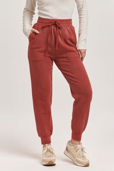 High rise ankle jogger pants with drawstring option to wear tightly or loosely for a comfy wear with utility front & back pouch pockets. Perfect for any comfy time, when you just want to cozy up! Solid color knit on relaxed fit.14" Front Rise (include waistband), 9 1/2" Leg Opening, 28" inseam (Size Small) 100% COTTON Machine wash cold, Tumble dry low Imported Comfy Relaxed Fit Joggers With Pockets, Comfy Joggers With Pockets For Leisure, Comfortable Joggers With Side Pockets For Loungewear, Comfy Activewear With Pockets, Comfortable Relaxed Fit Joggers With Side Pockets, Comfortable Joggers With Side Pockets In Relaxed Fit, Comfy Relaxed Fit Joggers With Drawstring, Comfy Joggers With Side Pockets For Loungewear, Fall Joggers With Side Pockets For Loungewear