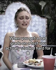 a woman sitting at a table with food in front of her and the caption reads, when you get a bad grade on a test you actually studies hard for