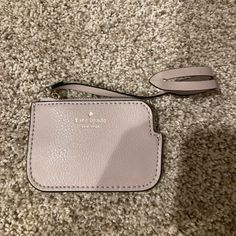 This Item Is From A Pet And Smoke Free Location. I Got It On A Kate Spade Bag (As Shown In Images. The Bag Is Not Included In This Listing. This Listing Is For The Bag Accent Only) But Am Selling Because I Don’t Need Or Will Use It. It Zips Open And Shut. No Stains Or Tears. It’s In New, Never Used Condition But It Doesn’t Have Actual Tags Because It Didn’t Come With Any As Shown In Images. It’s Like A Tan Grey Color. Kate Spade Beige Wallet For Everyday Use, Kate Spade Beige Wallets For Everyday Use, Kate Spade Rectangular Coin Purse For Everyday, Leather Bag Tag, Coin Purse Keychain, Purse Keychain, Kate Spade Card Holder, Kate Spade Crossbody Purse, Red Wallet