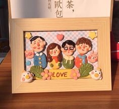 a wooden frame with some cartoon figures in it