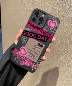 a person holding up a cell phone case with the words happiness good day on it