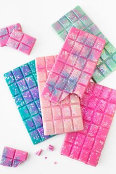 pink and blue candy bars with glitter on them