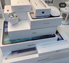 several apple products are stacked on top of each other