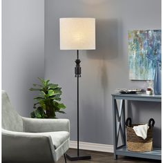 a living room scene with focus on the floor lamp