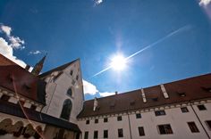 the sun shines brightly over an old building