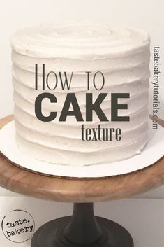 a white cake sitting on top of a wooden stand with the words how to cake texture