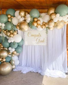 a backdrop with balloons and confetti on the wall for congrats grad