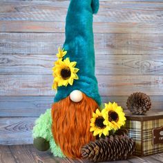 a stuffed gnome with sunflowers on his hat