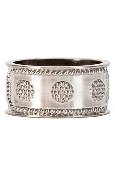 a silver ring with four circles on it