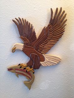 an eagle is hanging on the wall