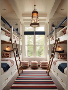 a room with bunk beds and rugs on the floor in front of a window