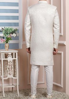 Ready-Made Sherwani With Trouser. Jacquard Brocade Fabric Top. Art Dupion Aligarhi Ready Made Trouser. Crafted in Chinese Collar Neck, and Full Sleeve. Satin Lining with Plain Work. High-Quality Matching Buttons. Please Note: The footwear shown in the picture is for presentation and photography purpose only. Color: There might be slight color variation due to lightings and flashes while photo shooting. The color may also vary because of different screen resolutions. Wash Care: Dry Clean Only. Traditional Suits With Chikankari Embroidery For Festive, Traditional Wedding Suits For Diwali, Elegant Formal Nehru Jacket With Self Design, Wedding Long Sleeve Fitted Kurta, Fitted Long Sleeve Wedding Kurta, Formal Nehru Jacket With Self Design For Diwali, Elegant Nehru Jacket With Self Design For Diwali, Fitted Long Sherwani With Chikankari Embroidery, Formal Fitted Bandhgala With Self Design