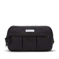 a black toiletry bag with two compartments on the front and one compartment closed up