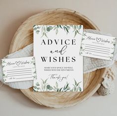 two wedding advice cards sitting on top of a wooden bowl next to some white yarn