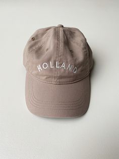 This Holland "Dad Hat" is a classic. The neutral tones are sure to match every outfit all year round. Embroidered locally in Grand Rapids. Regular fit 100% Cotton Hand wash Trendy Khaki Cotton Hat, Classic Spring Baseball Cap, Classic Dad Hat For Everyday Spring Use, Classic Everyday Dad Hat For Spring, Classic Spring Dad Hat For Everyday, Beige Summer Hats With Embroidered Logo, Khaki Cap For Fall, Classic Everyday Baseball Cap For Spring, Classic Spring Baseball Cap For Everyday