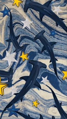 blue and white fabric with yellow stars on the bottom, in an abstract pattern that looks like waves