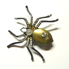 "Black-silver or silver colored steampunk necklace Spider, handmade decorated, including mechanical part of clockwork and miniature container (amulet, talisman, ju-ju, pill box, keepsake locket, stash box). The chain can easily be removed and the necklace turns into a brooch. Diameter of the Spider about: 2\" - 2 1/4\" / 5.5-6 cm Dimensions of the golden locket container: 7/8\" x 5/8\" / 2.2 cm x 1.5 cm; inside 5/8\" x 3/8\" / 1.5 cm x 1 cm Black-silver or silver colored chain. The black spider Victorian Metal Brooches As Gift, Handmade Metal Brooches As Gifts, Handmade Metal Brooches For Gifts, Gothic Brooch Jewelry Gift, Unique Metal Brooch Gift, Steampunk Locket Jewelry Collectible, Silver Steampunk Collectible Jewelry, Steam Punk Accessories, Steampunk Spider