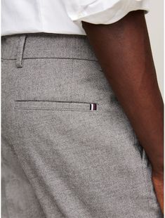 Tommy Hilfiger men's pant. A perfect choice for more formal occasions, these classic straight-leg trousers are made from a stretch-cotton blend and a marled knit (meaning threaded using two different color yarns) for textured appeal.  Material: 52% Better Cotton Initiative, 29% Polyesther Pes, 16% Viscose. Casual Wool Dress Pants With Tapered Leg, Casual Wool Dress Pants With Welt Pockets, Tommy Hilfiger Straight Leg Pants With Welt Pockets, Tommy Hilfiger Classic Tapered Leg Pants, Classic Tommy Hilfiger Tapered Leg Bottoms, Fitted Cotton Tommy Hilfiger Pants, Fitted Tommy Hilfiger Cotton Pants, Tommy Hilfiger Fitted Cotton Pants, Tommy Hilfiger Straight Leg Business Casual Bottoms