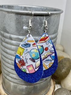 "Perfect teacher or bus driver gifts! Made of faux leather in 2 varieties. Options include: Round circle bus driver earrings with orange fine glitter base and gold hooks measuring Aprox 1.5\" long Teardrop teacher themed earrings with royal blue fine glitter base and silver hooks measuring Aprox 2\" long Teacher gifts, teacher earrings, bus driver gifts, bus driver earrings, glitter earrings, leather earrings, teacher appreciation, gifts for her, school earrings" School Earrings, Bus Driver Gift, Teacher Earrings, Bus Driver Gifts, Gold Hooks, Custom Wraps, Gifts Teacher, Large Necklace, Glitter Earrings