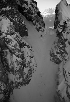 black and white photograph of snow covered mountains