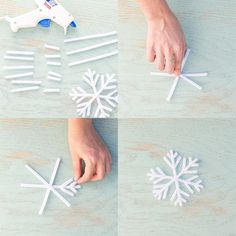 someone is making snowflakes out of popsicle sticks and glue on the table