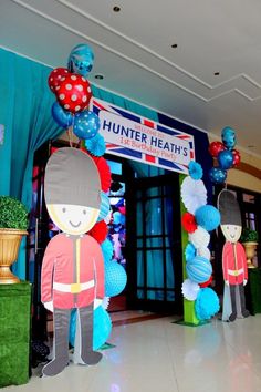 the entrance to hunter heath's is decorated with balloons and paper mache figures