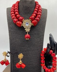 Handcrafted African Coral Beads Necklace - Unique Ethnic Jewelry for a Statement Look Materials: 1. Natural/Original African Coral bead 2. Gold color accessories  3. This listing contains 2 layers of necklace, 1 bracelet and a set of dangling earrings. Colour of Accessories: Gold  Items are 1 layer of necklace, 2 bracelets, a pair of earrings and  Description: 🌍 African Elegance: Immerse yourself in the rich cultural tapestry of Africa with this exquisite necklace. Each vibrant coral bead tells Traditional Red Jewelry Sets With Colorful Beads, Beaded Necklaces For Traditional Ceremonies, Traditional Beaded Bracelets With Round Beads For Celebrations, Traditional Beaded Bracelets For Celebration With Round Beads, Traditional Gold Bead Necklaces For Ceremonies, Traditional Beaded Bracelets For Celebration, Traditional Round Beads Jewelry For Ceremonies, Traditional Jewelry With Round Beads For Ceremonies, Traditional Round Beaded Jewelry For Ceremonies