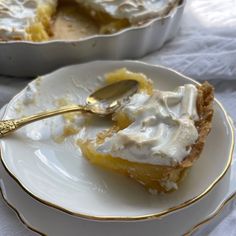 a piece of pie on a plate with a spoon