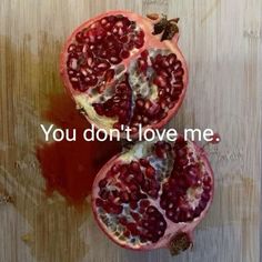 two pomegranates with the words you don't love me