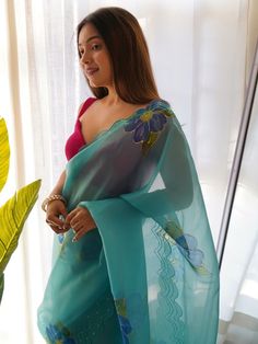 Be stylish and create and ascertain a classy look on everyone by draping this sky blue color saree on organza material with a digitally printed design with hand work all over. Paired up this sky blue organza material saree with a pink color plain blouse. This delicate saree is 5.50 meters long and comes with fully unstitched blouse material. Saree always gives a decent look, everyone looks beautiful in its drape saree linen saree are the best option for party wear, or festival wear choose to loo Blue Embroidered Saree For Party, Party Blue Embroidered Saree, Party Embroidered Blue Saree, Embroidered Blue Blouse Piece For Party, Blue Blouse Piece With Floral Embroidery For Party, Traditional Blue Blouse Piece For Party, Traditional Blue Blouse For Party, Blue Semi-stitched Embroidered Fabric, Embroidered Blue Pre-draped Saree For Diwali