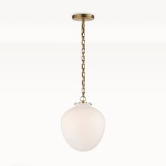 a white light hanging from a brass colored ceiling fixture with a chain attached to it