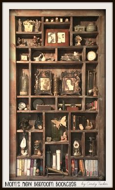 an old bookcase with many different items on it