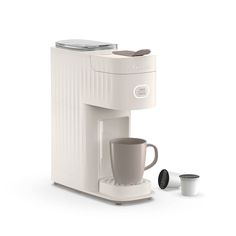 a white coffee maker with a cup next to it