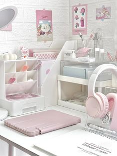 a white desk topped with lots of pink items