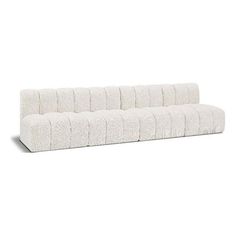 a white couch sitting on top of a white floor