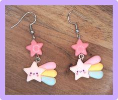 Pride Month Sale! Discount: 20% off when you buy 2 items + free pride themed jewelry gift! Promo code: HAPPYPRIDEMONTH Glisten with celestial charm wearing these adorable Cute Shooting Star Earrings. The dangling design adds a touch of whimsy to any outfit, making them perfect for both casual and special occasions. Crafted to be hypoallergenic, these earrings are gentle on sensitive skin, ensuring both comfort and style. Each pair comes with a surprise earring mystery blind bag, adding an element of excitement and intrigue to your jewelry collection. These earrings are a delightful way to showcase your unique fashion sense and love for all things celestial. Embrace the magic of these earrings and let your style shine bright like a shooting star. You get two pairs of handmade earrings, one Adjustable Kawaii Dangle Earrings, Cute Charm Earrings For Gifts, Fun Star-shaped Jewelry For Gifts, Cute Star Charm Dangle Earrings, Cute Dangle Jewelry With Star Charm, Cute Dangle Earrings With Star Charm, Cute Rainbow Dangle Earrings, Playful Star Charm Jewelry For Gifts, Cute Star Charm Jewelry Gift