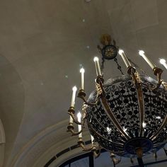 a chandelier hanging from the ceiling in a building