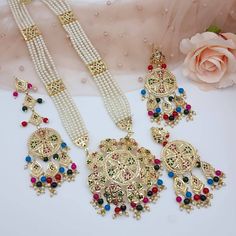 Shop These Beautiful Long Necklace Pendant Rani Haar Set for all Vibrant colors for your special events. Set Includes- Necklace, Earrings, and Matha Tikka Jewelry Care -- Keep all the jewelry away from water, perfumes, and other harsh chemicals To clean wipe with a lint-free cloth to retain the shine Please Note- No Returns No Exchange Multicolor Gold Plated Jewelry For Wedding, Traditional Festive Jewelry Sets With Long Necklace, Multicolor Gold-plated Jewelry For Wedding, Long Latkans Necklace For Wedding, Multicolor Gold Plated Jewelry Sets For Festivals, Meenakari Long Necklace For Festivals, Festive Multicolor Gold Plated Jewelry Sets, Eid Meenakari White Jewelry Sets, Festive Multicolor Gold-plated Jewelry Sets