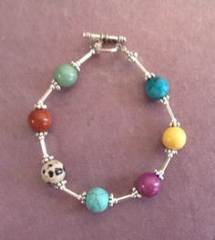 This colorful summer pastel bracelet will go with almost anything you choose to wear.  The gemstones include Jasper, Jade, Turquoise and Quartz. This pretty multicolor bracelet will be a fun accent to pick up often because the colors will add interest to so many outfits. The colors include turquoise, yellow, purple, blue, peach, and green. It has silver spacers, small silver tubes, and a silver toggle closure. , 8 1/4 inches long Multicolor Natural Stones Beaded Bracelet, Multicolor Natural Stones Jewelry For Friendship, Multicolor Nickel-free Crystal Bracelet, Multicolor Natural Stones Beaded Bracelets For Jewelry Making, Nickel-free Multicolor Beaded Bracelets, Nickel Free Multicolor Beaded Bracelets, Multicolor Natural Stones Crystal Bracelet For Jewelry Making, Multicolor Natural Stone Crystal Bracelet For Jewelry Making, Multicolor Gemstone Beads Bracelets