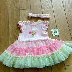 Nwt! Girls Onesie With Tutu Attached. Also Comes With Headband. Size 12 Months. Brand Is Little Me. Colors Are Pink, Yellow And Green. Cute Spring Play Sets, Pink Play Sets For Spring, Pink Spring Play Sets, Easter Tutu Dress, Long Sleeve Sparkly Dress, Tulle Ruffle Dress, Pretty Blue Dress, Colorful Floral Dress, White Baby Dress